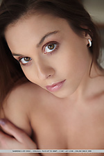 Sabrisse a sabrisse bares her petite body and sexy legs as   she sensually poses on the sofa.