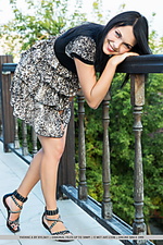 Yvonne a yvonne a playfully poses by the veranda as she bares her pink pussy.