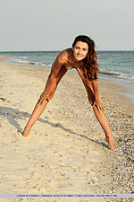 Lorian lorian playfully poses by the beach as she bares her slender, naked body.