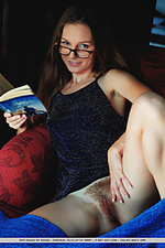 Sofi shane nerdy sofi shane flaunts her hairy snatch while reading on the chair.