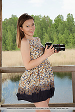 Dominika jule newcomer dominika jule strips by the lake baring her creamy body and pink cherry.