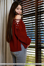 Delphina delphina bares her perky tits as she strips in front of the camera.