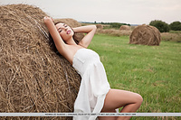 Niemira niemira bares her smoking hot body as she sensually poses in the field.