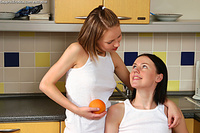 Petite teen lesbians in steamy kitchen action