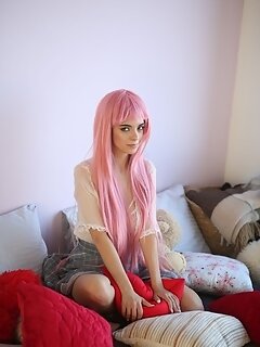 Teen sweetheart with a long pink hair gets nude and flashes her gorgeous breasts and pussy
