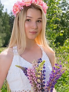 Watch as this cute blonde teen plays on the flower field and gets rid of her sexy white dress for extra pleasure.